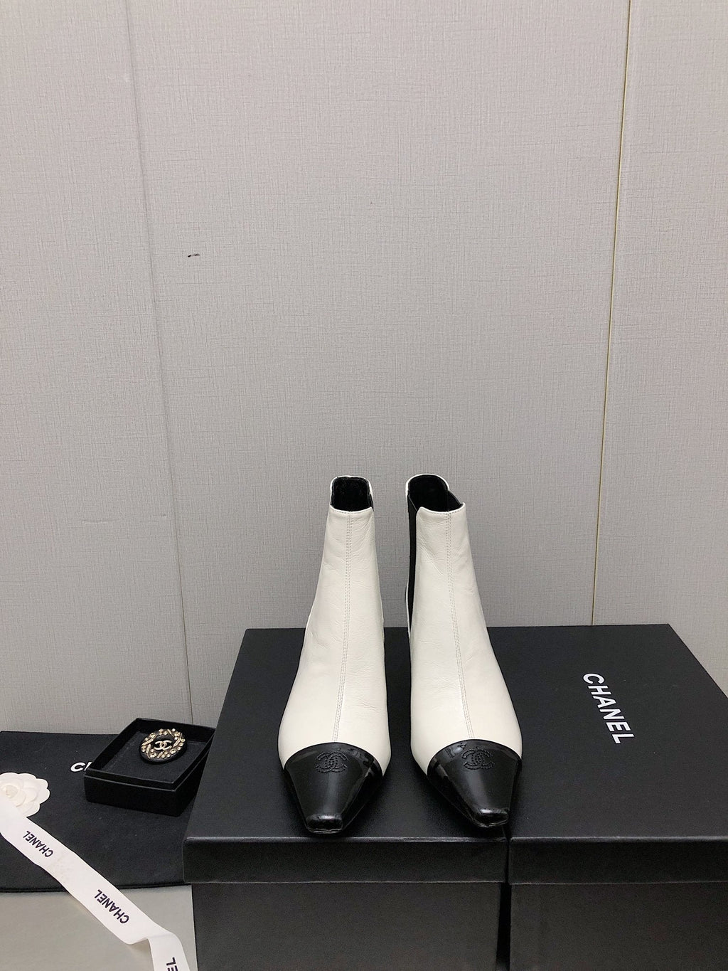 CHANEL SHORT BOOTS IN WHITE MIX BLACK SHEEPSKIN
